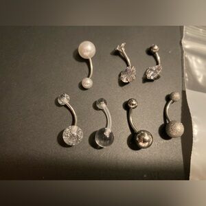Belly button rings. Set of 7. Brand new in package. See pictures for all detail